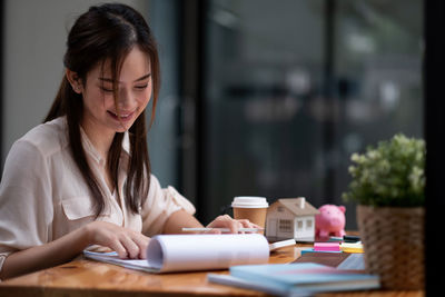 Businesswoman working at table