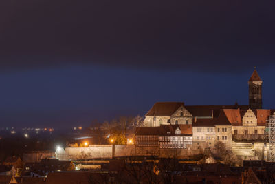 High angle view of illuminated buildings in city at night