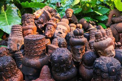 Close-up of old abandoned damaged buddha statues