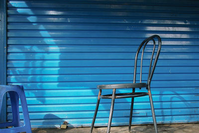 Chairs against blue wall