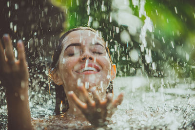 Young woman swimming in pool