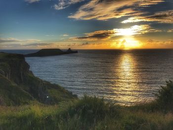 Scenic view of sea against sky during sunset