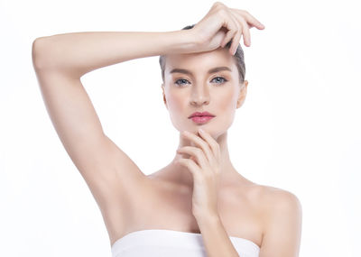 Portrait of a beautiful young woman over white background