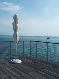 Sculpture by the sea.  scenic view of sea against sky