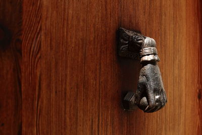 Close-up of open door on wooden floor