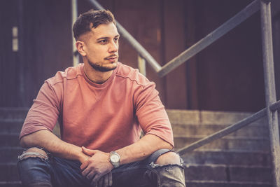 Young man looking away outdoors