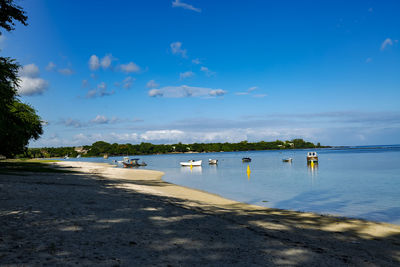 Scenic view of sea against blue sky