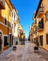 Alley amidst buildings in city