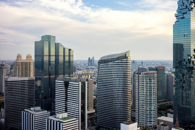 Modern buildings in city against sky