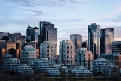 Buildings in city against sky