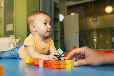 Boy playing with toy at home