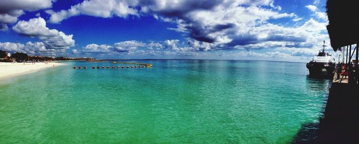 Scenic view of sea against cloudy sky