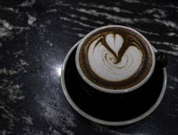 Close-up of coffee cup on table