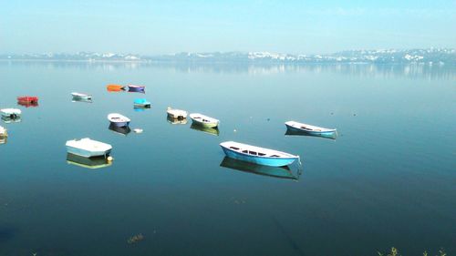 High angle view of boats moored at lake against sky