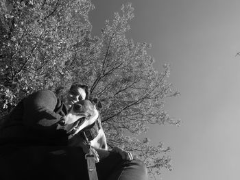 Full length of mother and tree against sky