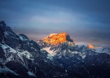 Scenic view of snowcapped mountains against sky during winter