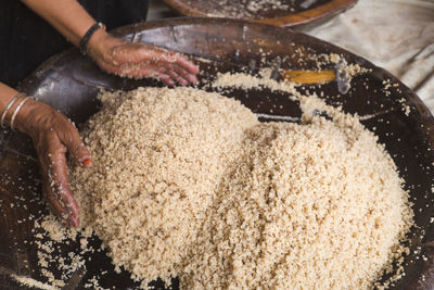 Preparing couscous in m'hamid el ghizlane or lamhamid ghozlane is in the zagora province, morocco