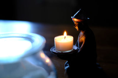 Tea light candles in dark room