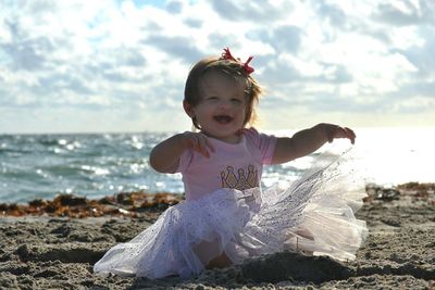 Girl playing on beach