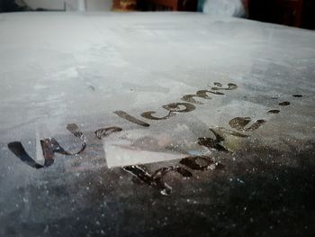 Close-up of text on white table