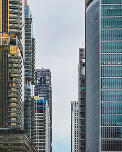 Low angle view of modern buildings against sky in city