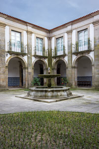 Facade of historic building against sky