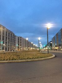 City street against cloudy sky