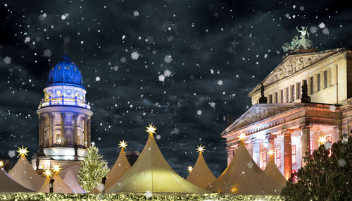 Illuminated city during winter at night