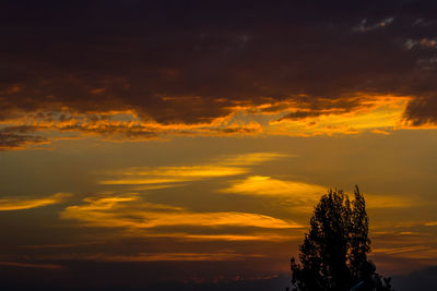 Low angle view of cloudy sky at sunset