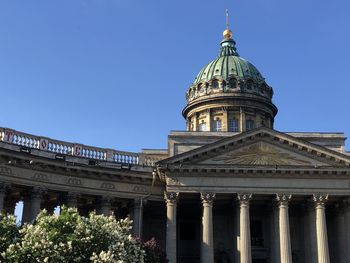 Low angle view of building against clear blue sky