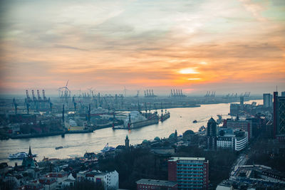 High angle view of harbor against sky during sunset