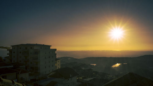 View of cityscape against sky during sunset