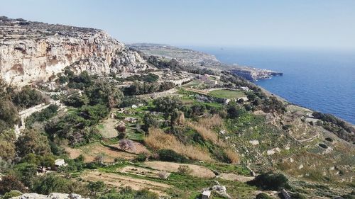 High angle view of countryside landscape against the sea