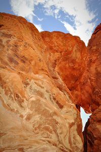 Low angle view of rock formation against sky