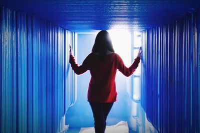 Low angle view of woman in dark room