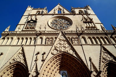 Low angle view of church against blue sky