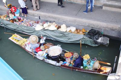 High angle view of people in boats at market stall