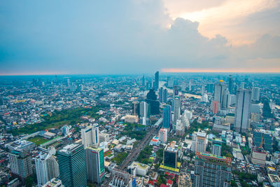 Aerial view of modern buildings in city against sky