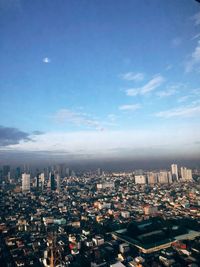 High angle view of city against cloudy sky
