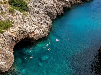 High angle view of rocks by sea