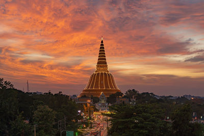 Low angle view of buildings against sky during sunset