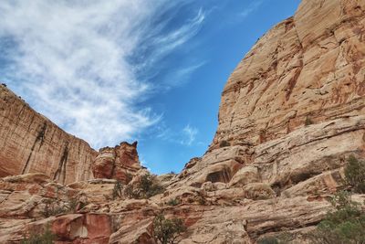 Low angle view of rock formation against sky