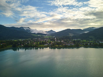 Scenic view of lake and mountains against sky