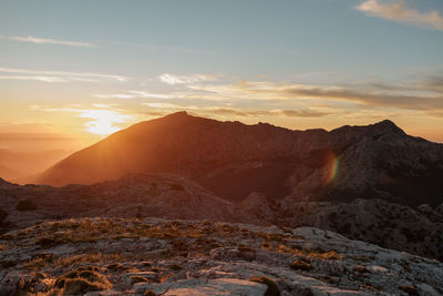 Scenic view of mountains against sky during sunset