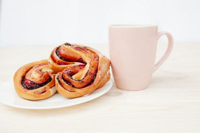 Close-up of coffee served on table