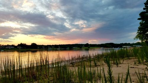 Scenic view of lake against sky during sunset