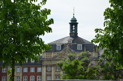 Low angle view of clock tower against sky