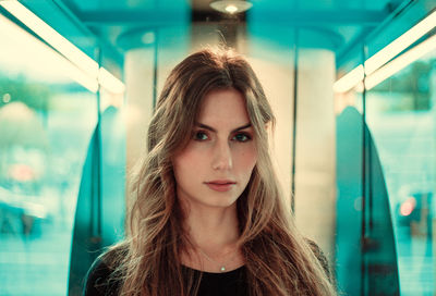 Close-up portrait of beautiful young woman in vehicle