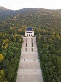 High angle view of building and trees on landscape