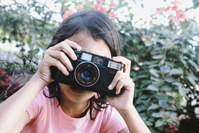 Portrait of woman photographing